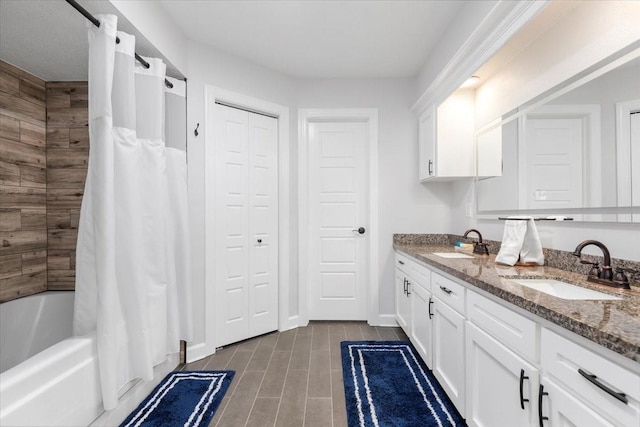 bathroom with vanity and shower / tub combo with curtain