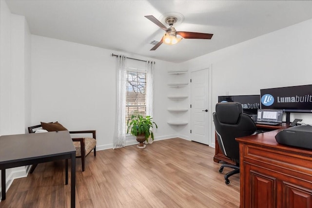 office area with ceiling fan and light wood-type flooring