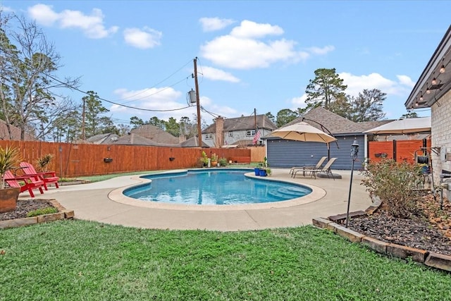 view of pool featuring a yard and a patio