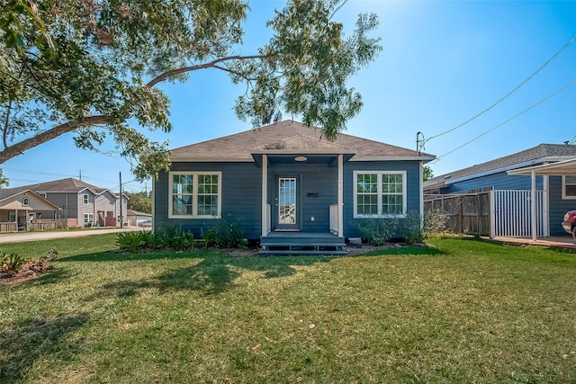 bungalow-style house with a front yard