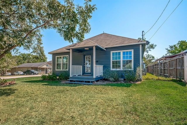 bungalow-style house featuring a front yard