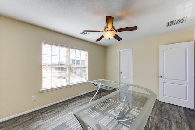 office space with ceiling fan and dark hardwood / wood-style flooring