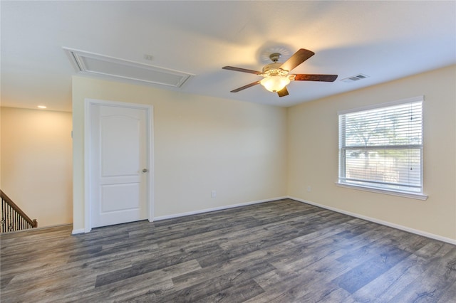 empty room featuring ceiling fan and dark hardwood / wood-style flooring