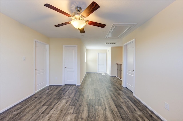 unfurnished room with dark wood-type flooring and ceiling fan