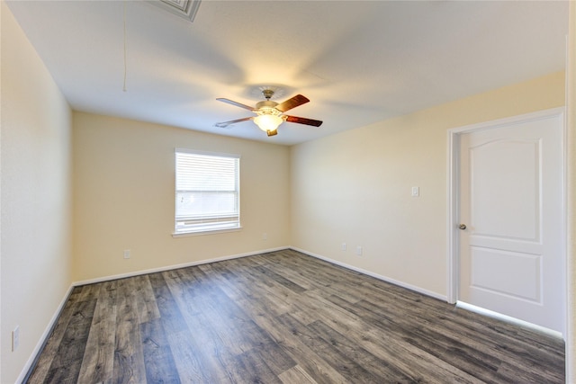 unfurnished room with ceiling fan and dark hardwood / wood-style floors