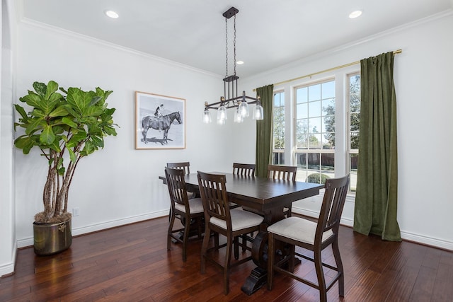 dining room featuring crown molding and dark hardwood / wood-style floors