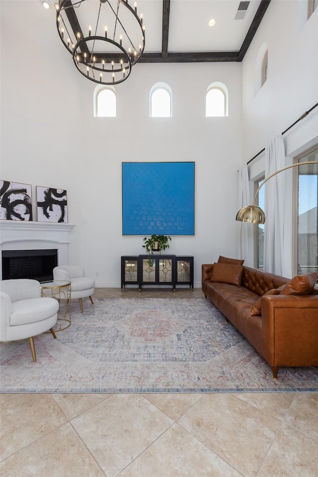 tiled living room with beam ceiling and a towering ceiling