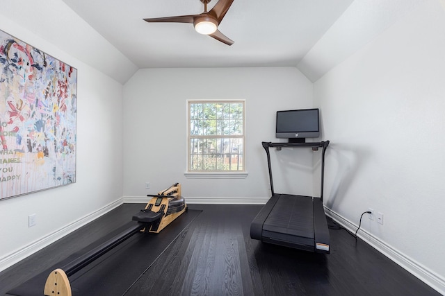 exercise room featuring ceiling fan, lofted ceiling, and dark hardwood / wood-style flooring