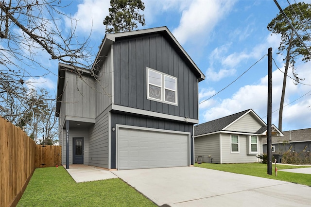 view of front of house featuring a garage and a front yard