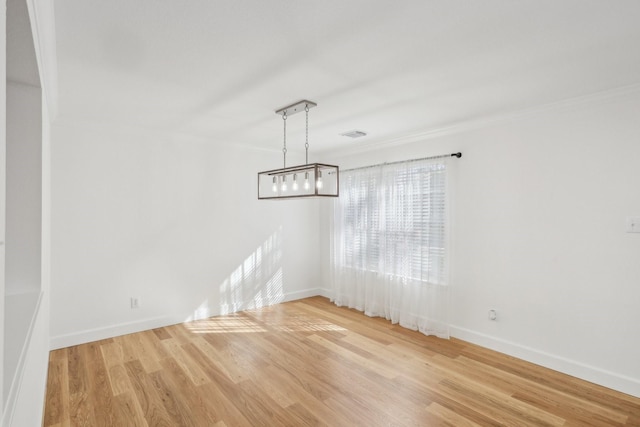 unfurnished dining area featuring crown molding and wood-type flooring