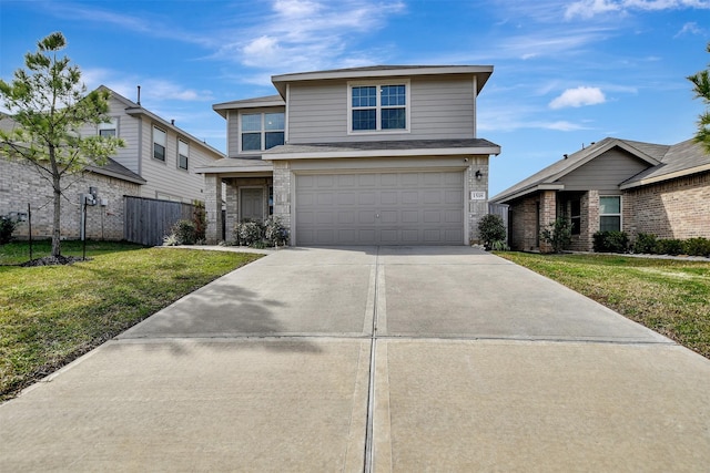 view of front property with a garage and a front yard