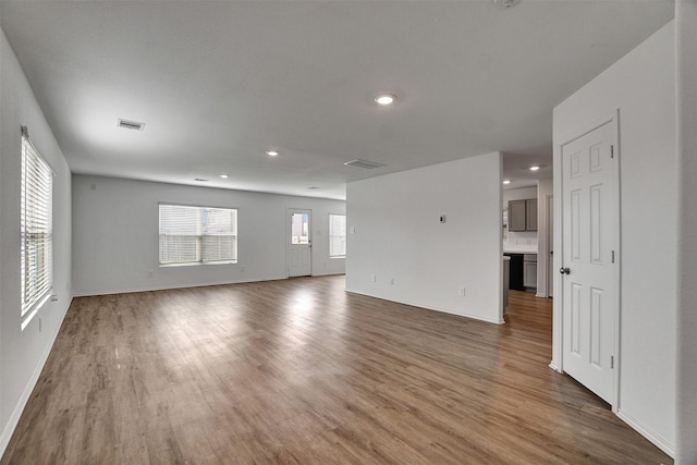 spare room featuring hardwood / wood-style floors