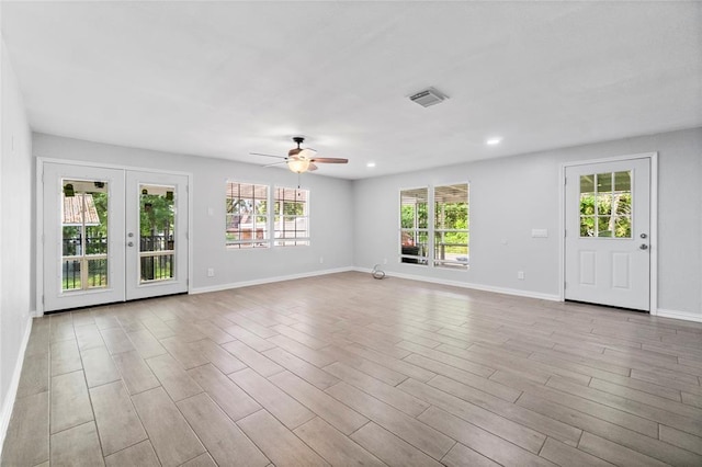 spare room featuring french doors and ceiling fan