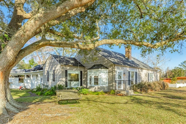 302 E Jackson St, West Columbia, TX 77486 - rear view of property with a yard