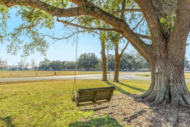302 E Jackson St, West Columbia, TX 77486 - view of home's community featuring a lawn
