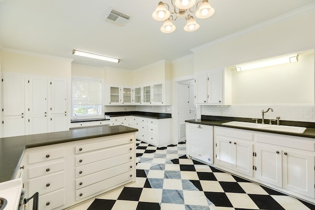 302 E Jackson St, West Columbia, TX 77486 - kitchen featuring tasteful backsplash, ornamental molding, sink, and white cabinets