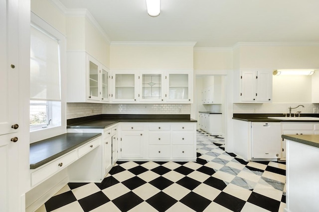 302 E Jackson St, West Columbia, TX 77486 - kitchen featuring crown molding, sink, and white cabinets