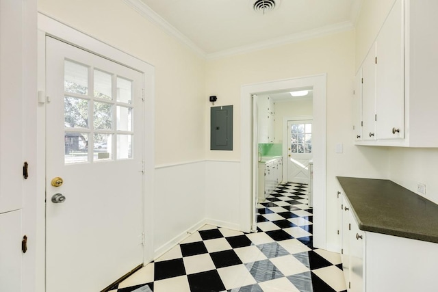 302 E Jackson St, West Columbia, TX 77486 - doorway to outside with ornamental molding and electric panel