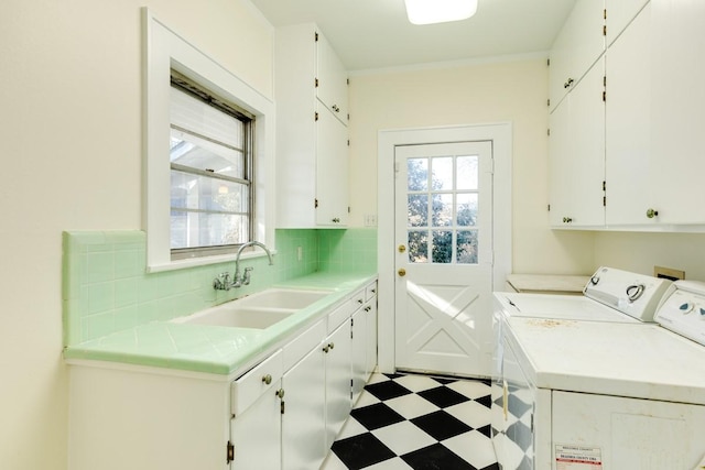 302 E Jackson St, West Columbia, TX 77486 - washroom featuring cabinets, sink, and washing machine and dryer