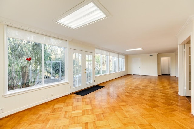 302 E Jackson St, West Columbia, TX 77486 - interior space with light parquet flooring, ornamental molding, and french doors
