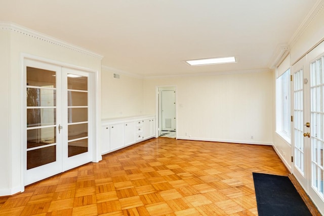 302 E Jackson St, West Columbia, TX 77486 - empty room featuring ornamental molding, french doors, and light parquet flooring
