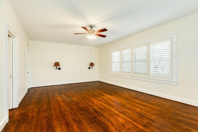 302 E Jackson St, West Columbia, TX 77486 - spare room with dark wood-type flooring and ceiling fan