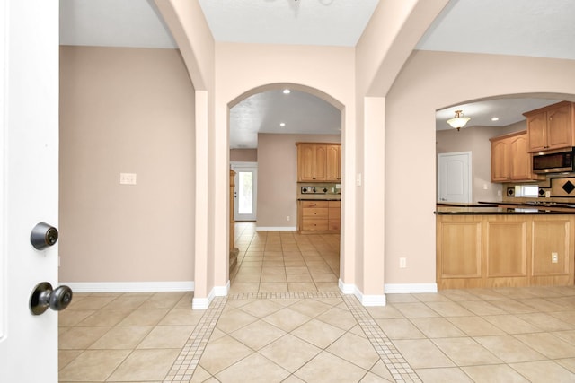 kitchen with backsplash and light tile patterned flooring