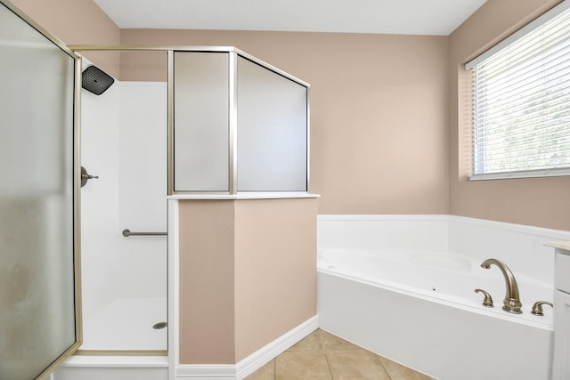 bathroom featuring tile patterned flooring and plus walk in shower