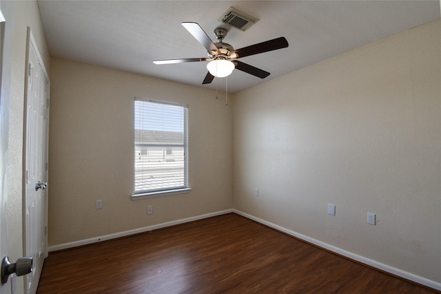 unfurnished room with dark hardwood / wood-style floors and ceiling fan