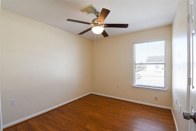 empty room with dark wood-type flooring and ceiling fan