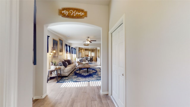 corridor with light hardwood / wood-style floors