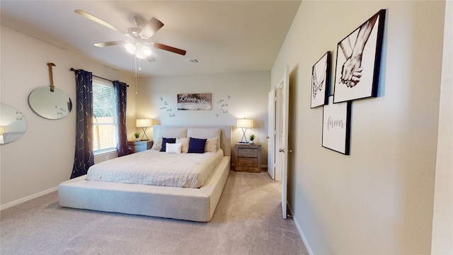 bedroom featuring light colored carpet and ceiling fan