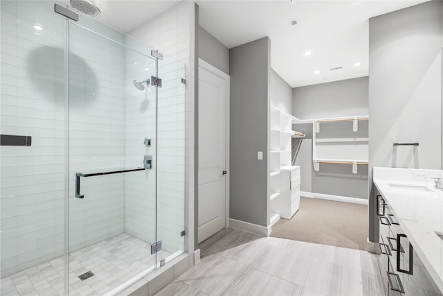 bathroom with vanity and an enclosed shower