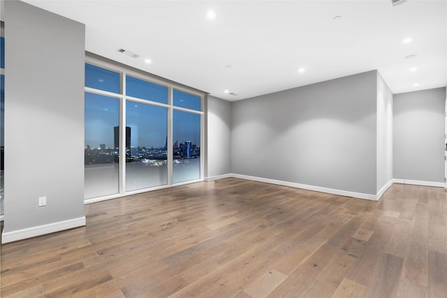 empty room featuring hardwood / wood-style flooring