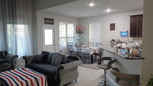 living room with light tile patterned floors