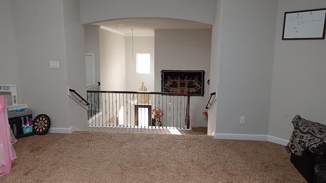 interior space with crown molding and carpet floors