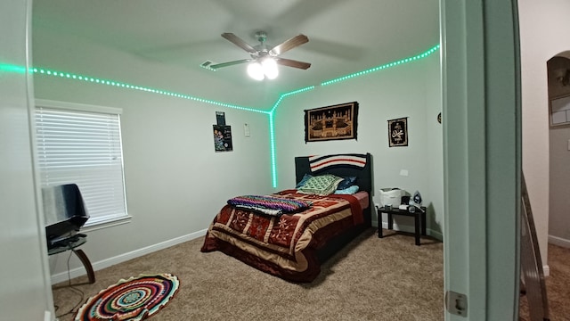 bedroom featuring vaulted ceiling, carpet, and ceiling fan