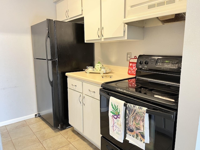 kitchen featuring white cabinetry, light tile patterned floors, and black appliances