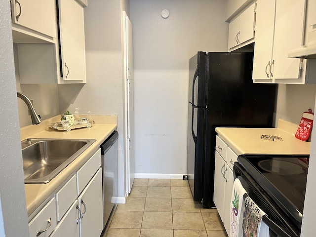 kitchen featuring light tile patterned flooring, dishwasher, sink, white cabinets, and electric range