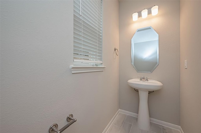 bathroom with tile patterned floors