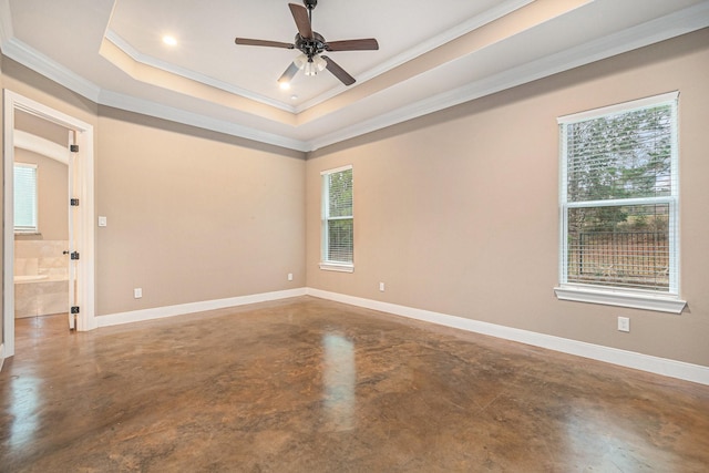 empty room with crown molding, concrete flooring, a raised ceiling, and ceiling fan