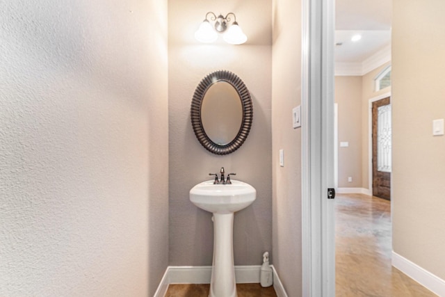 bathroom with crown molding