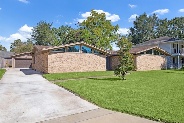 view of front facade with a garage and a front lawn