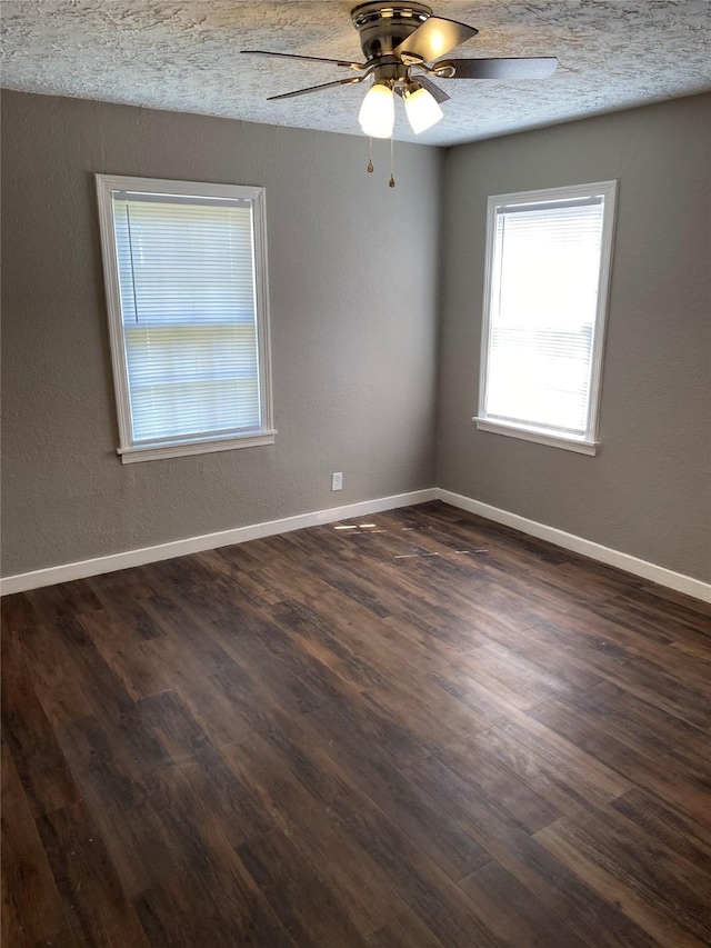 unfurnished room featuring dark hardwood / wood-style floors, a textured ceiling, and ceiling fan