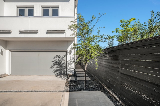 view of property exterior featuring a garage