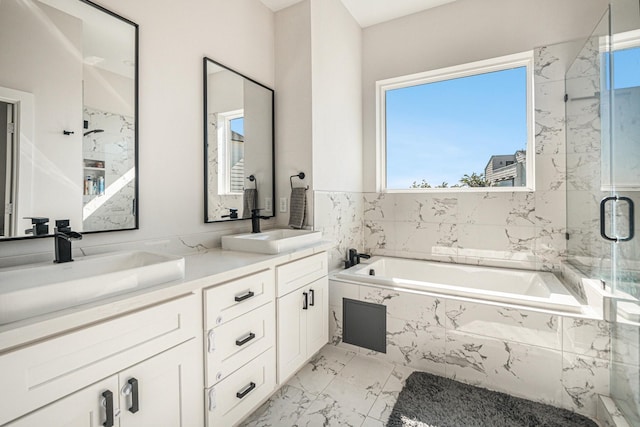 bathroom featuring independent shower and bath and vanity