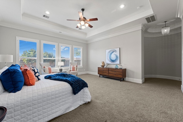 bedroom featuring crown molding, ceiling fan, a tray ceiling, and carpet floors