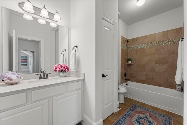 full bathroom with vanity, toilet, and tiled shower / bath combo