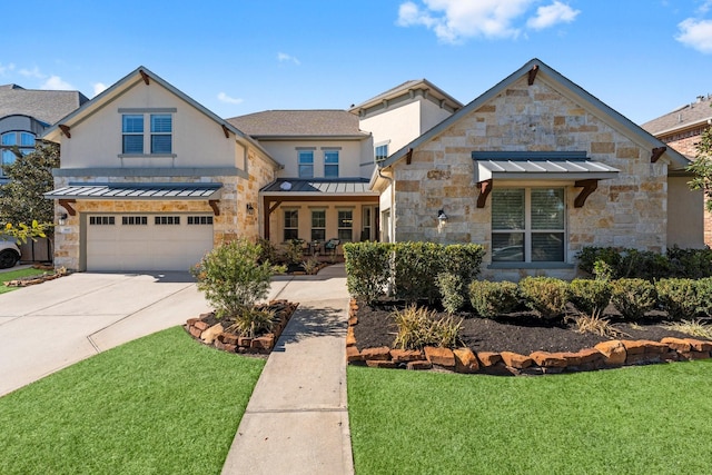 view of front of home with a garage and a front lawn