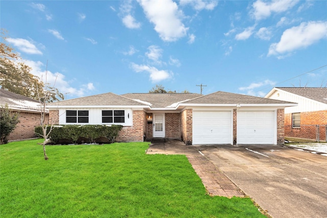 single story home featuring a garage and a front lawn